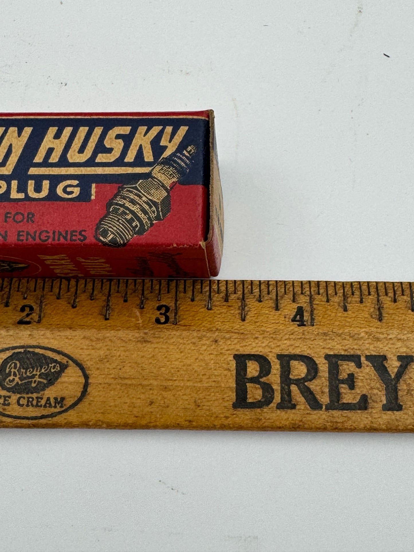 Vintage Blue Crown Husky Spark Plug
